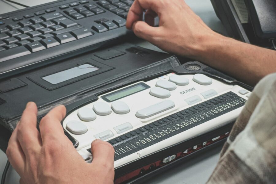 person using braille writer